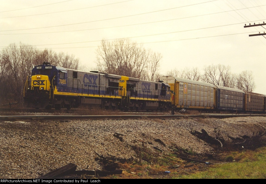 Eastbound vehicle train approaches Alexis